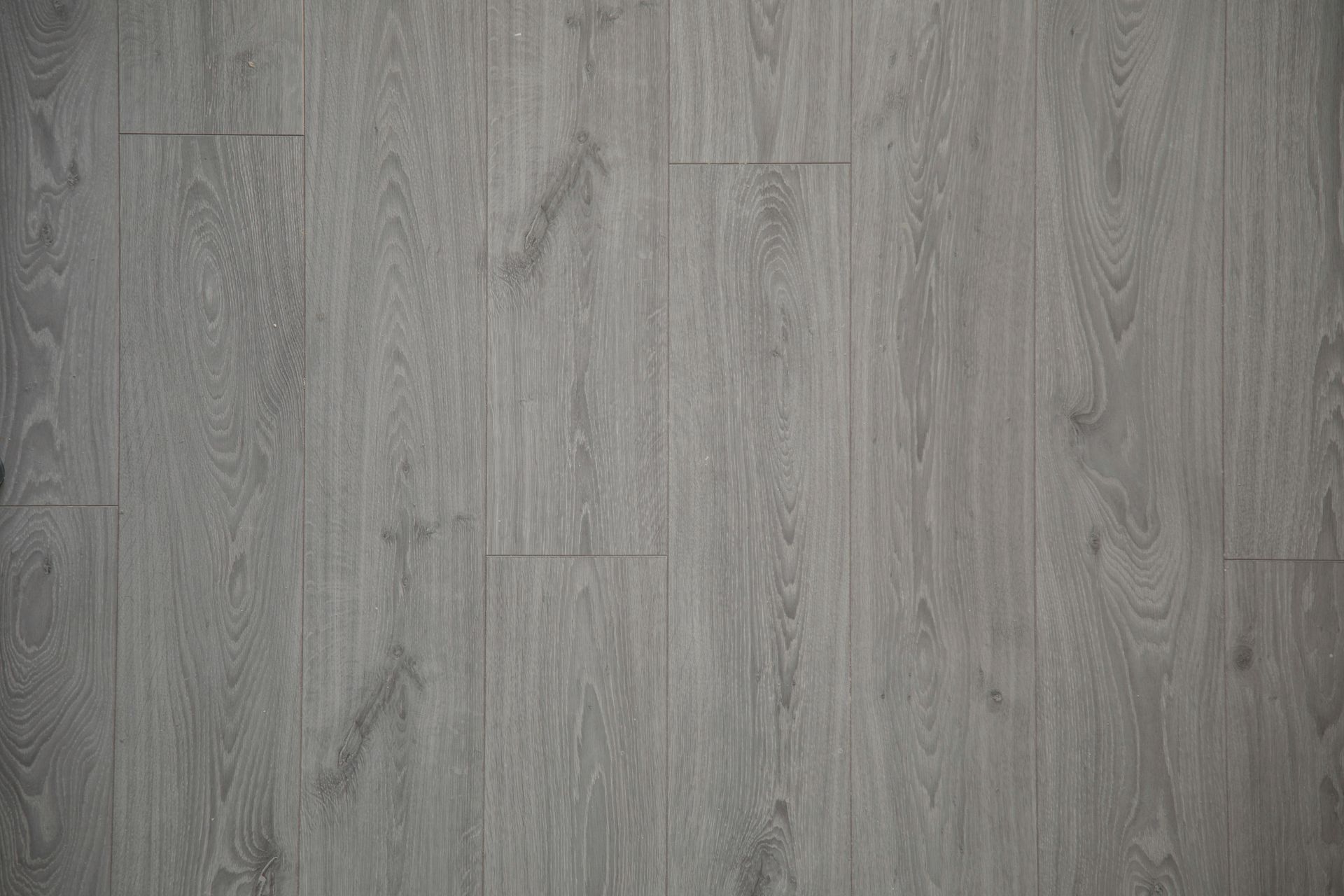 Close-up view of gray wooden floor planks with natural texture and pattern.